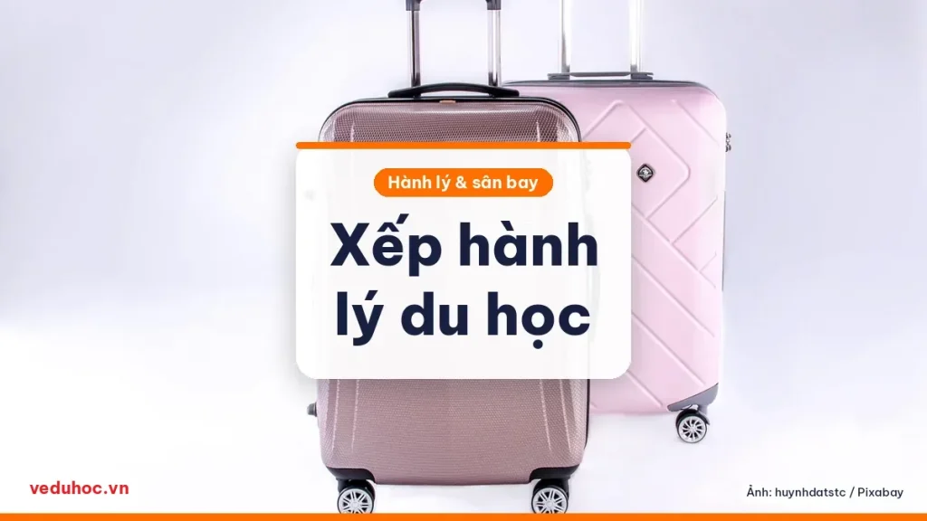 Hai chiếc vali màu hồng đặt cạnh nhau trên nền sáng, minh hoạ chuẩn bị hành lý du học