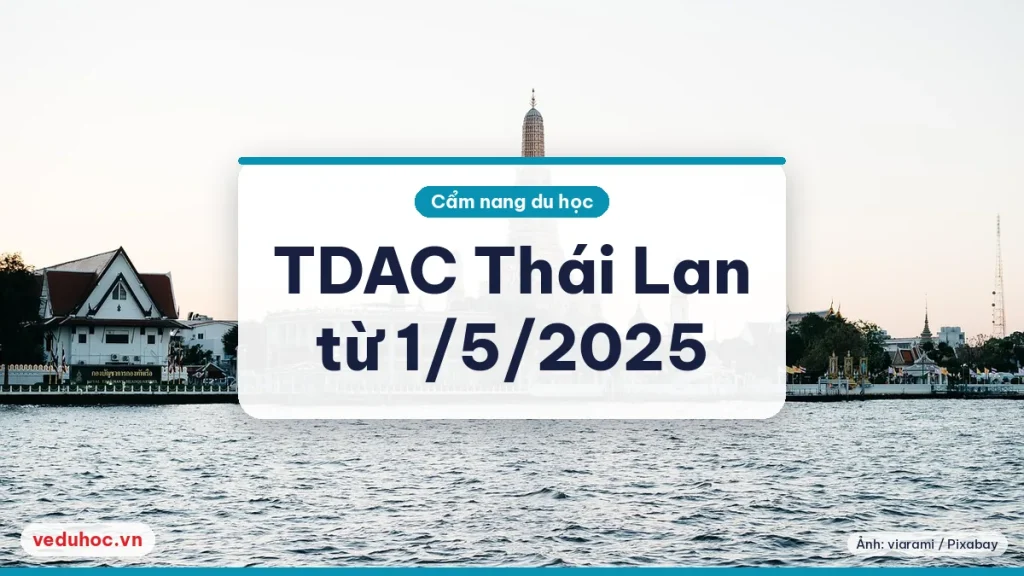 Ngôi chùa có tháp cao bên bờ sông ở Bangkok dưới trời trong, minh hoạ chuyến đi Thái Lan